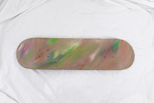 Load image into Gallery viewer, Skateboard deck with a multicolored abstract design on a white background
